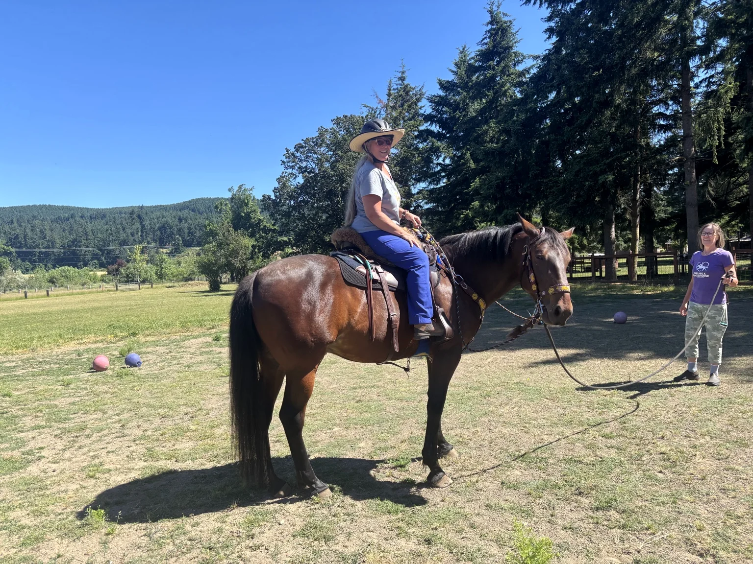 Horse and rider enjoying a sunny day outdoors
